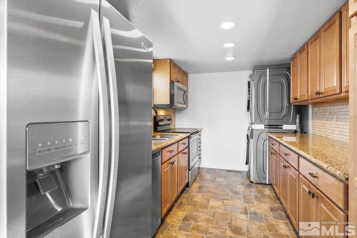 3475 Balboa Drive Reno, NV 89503 - Photo 11 of 37 a kitchen with stainless steel appliances granite countertop a refrigerator a stove and a sink