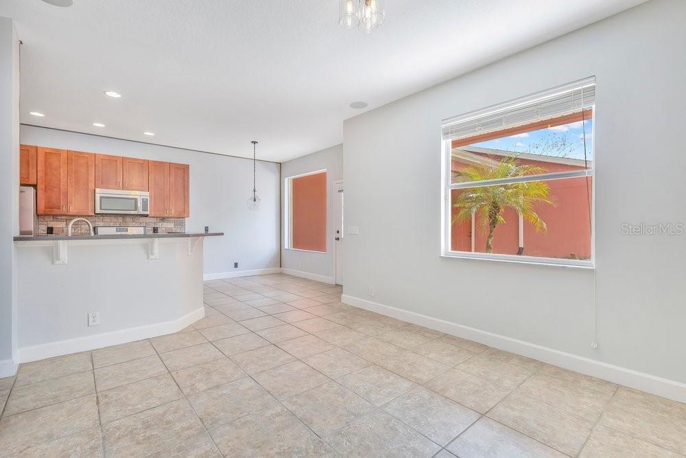 125 Manor View Lane DeLand, FL 32724 - Photo 8 of 37 a kitchen with stainless steel appliances granite countertop a refrigerator and a stove top oven