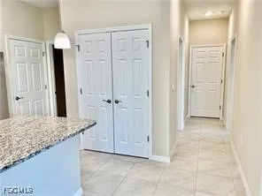 a bathroom with a granite countertop sink and shower
