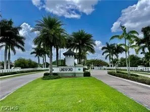 a view of a park with palm trees