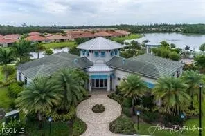 an aerial view of a house with garden space and outdoor seating