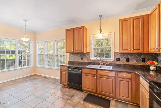 a open kitchen with granite countertop a sink and a stove