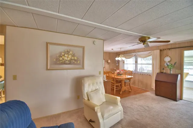 a dining room with furniture and a window