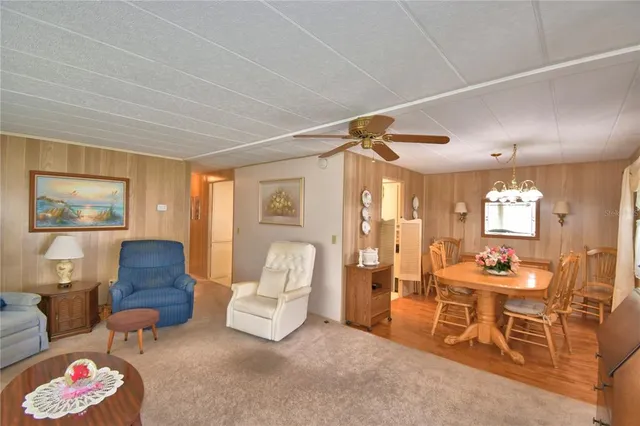 a living room with furniture and a lamp