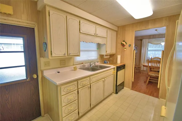 a spacious bathroom with a sink a mirror and a bathtub