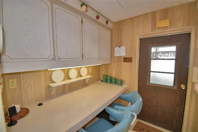 a room with a table and chairs