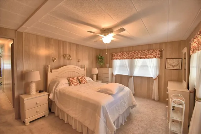 a bedroom with double bed and a window