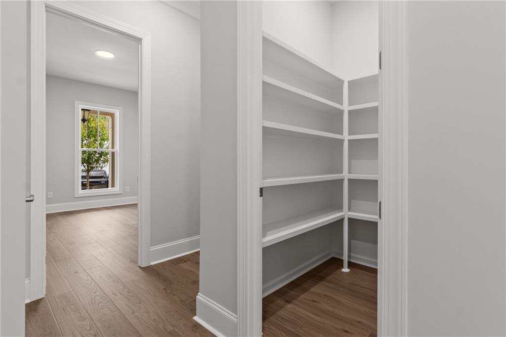 10025 Ruppel Lane Johns Creek, GA 30005 - Photo 13 of 23 a view of a room with wooden floor and closet