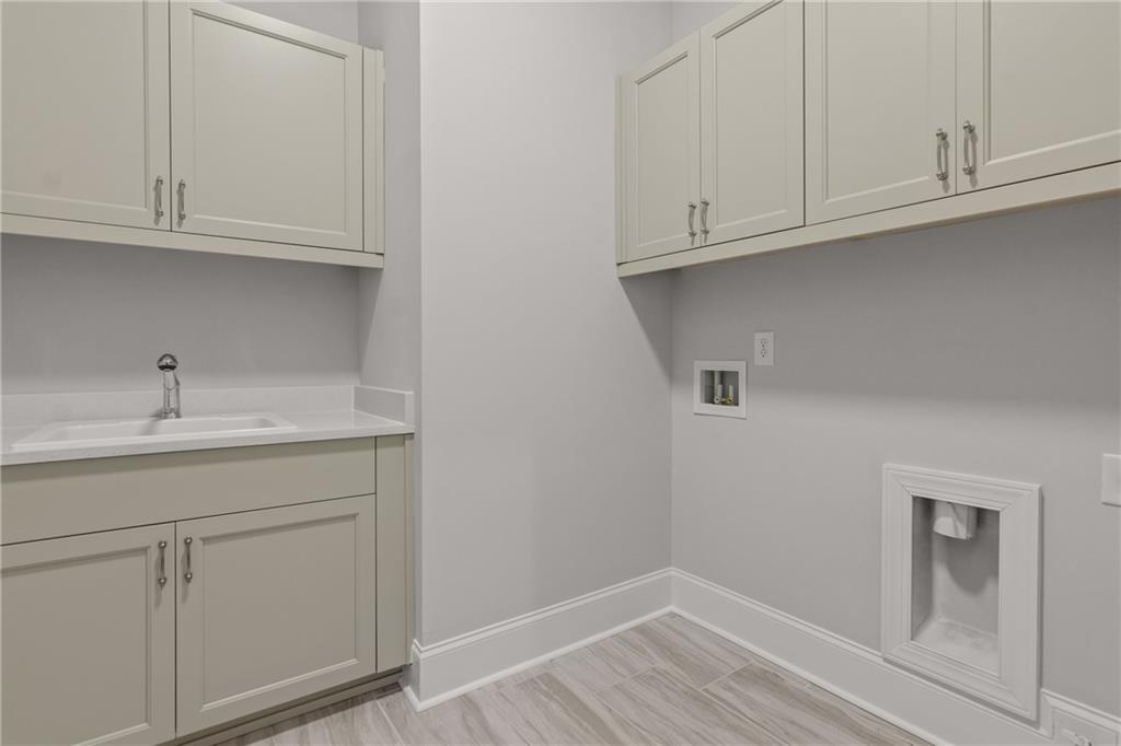 10025 Ruppel Lane Johns Creek, GA 30005 - Photo 14 of 23 a view of cabinets and utility room with closet