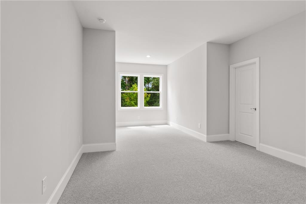 10025 Ruppel Lane Johns Creek, GA 30005 - Photo 19 of 23 a view of an empty room with a window