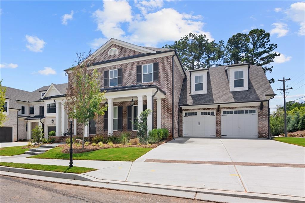 10025 Ruppel Lane Johns Creek, GA 30005 - Photo 2 of 23 a front view of a house with a yard