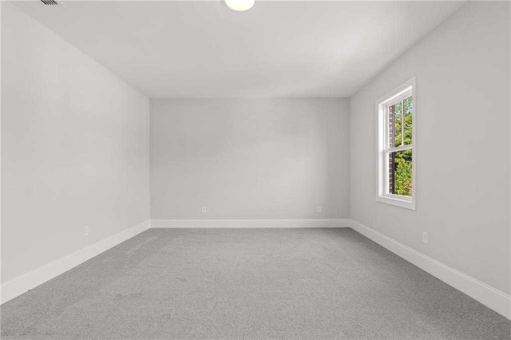 10025 Ruppel Lane Johns Creek, GA 30005 - Photo 23 of 23 an empty room with windows
