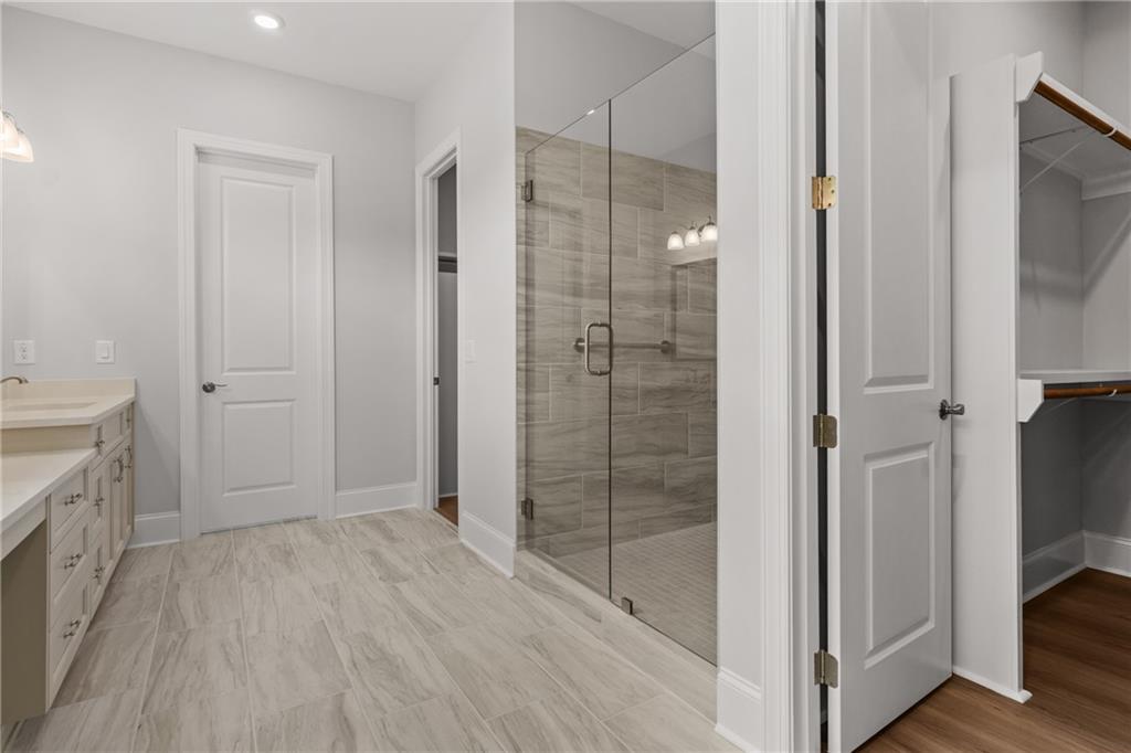 10025 Ruppel Lane Johns Creek, GA 30005 - Photo 10 of 23 a bathroom with a shower and a sink
