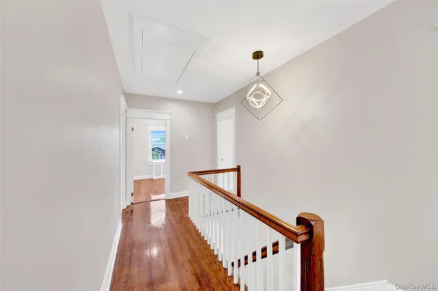 a view of a hallway with stairs