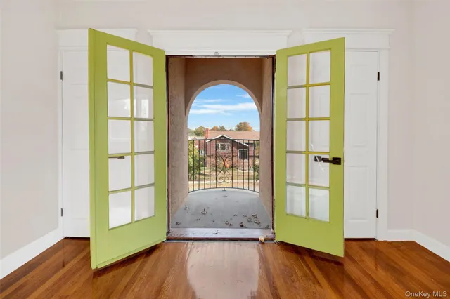a view of front door with wooden floor