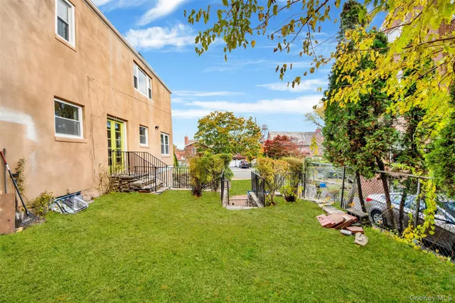 a view of a room with gym equipment and a large tree