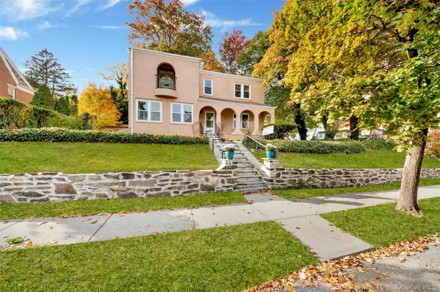 a front view of a house with garden