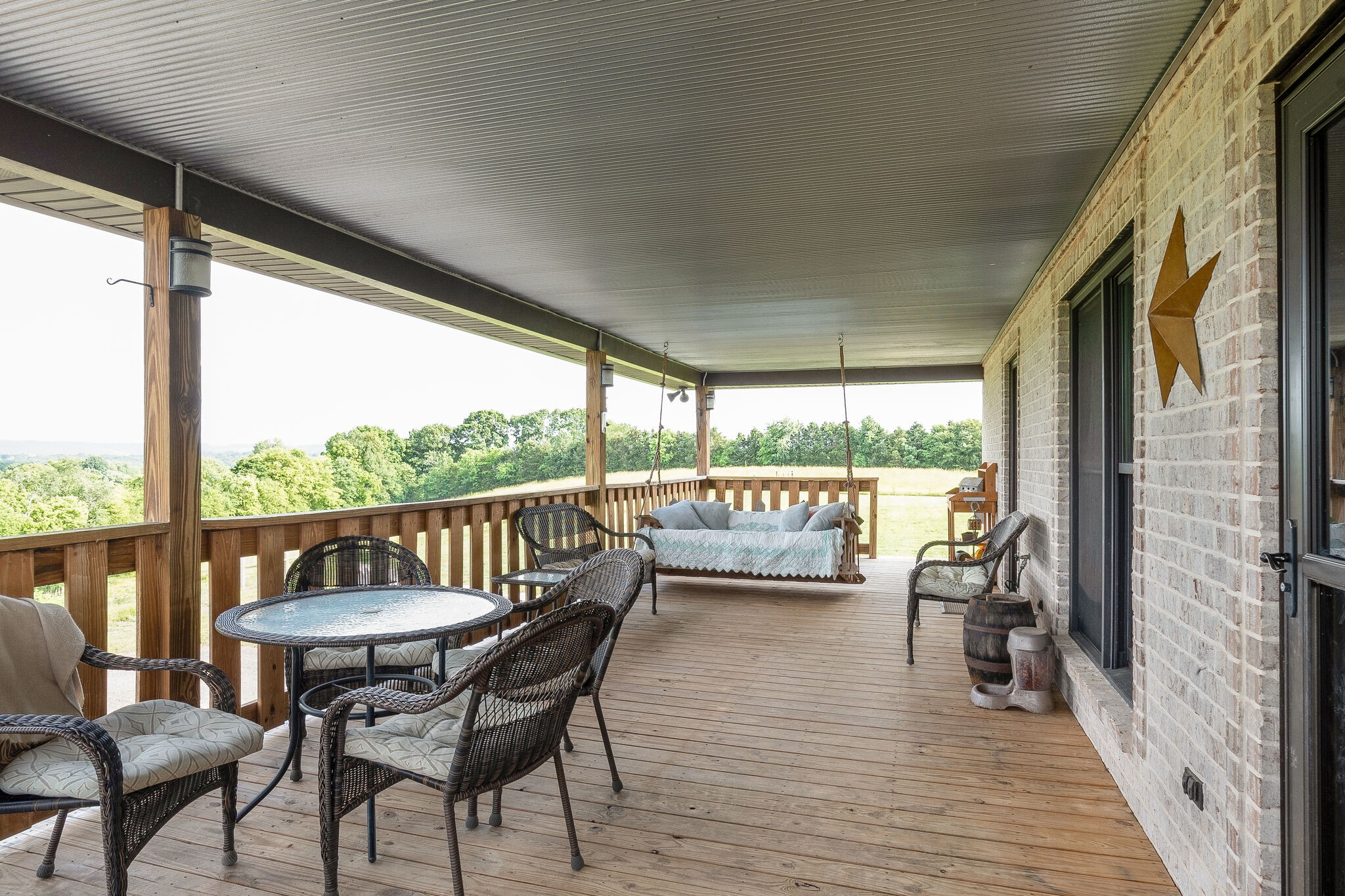 95 Switchboard Road Brush Creek, TN 38547 - Photo 28 of 35 a view of a chairs and table in patio with a yard