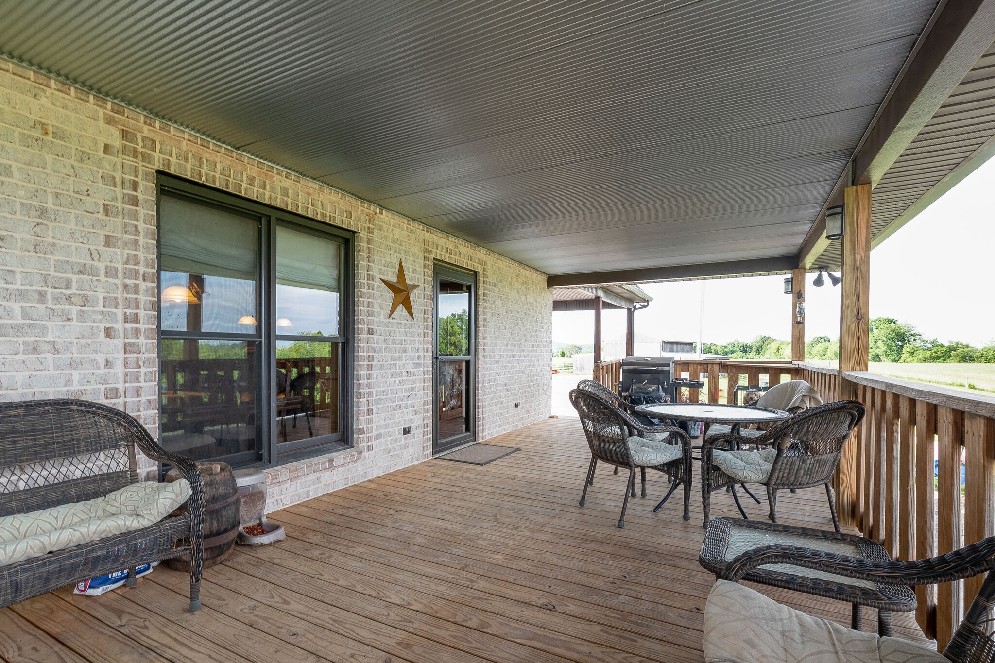 95 Switchboard Road Brush Creek, TN 38547 - Photo 29 of 35 a balcony with furniture and wooden floor