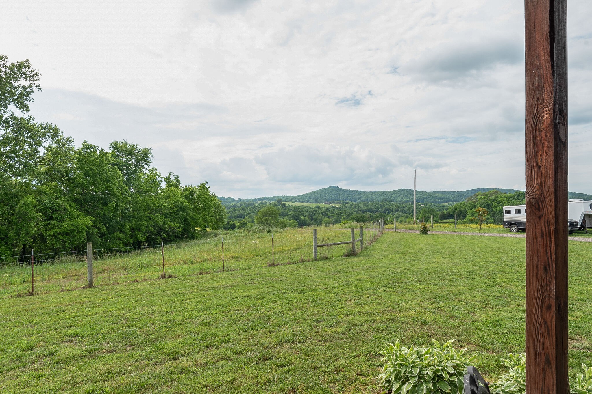 95 Switchboard Road Brush Creek, TN 38547 - Photo 4 of 35 a view of a green field with a tree