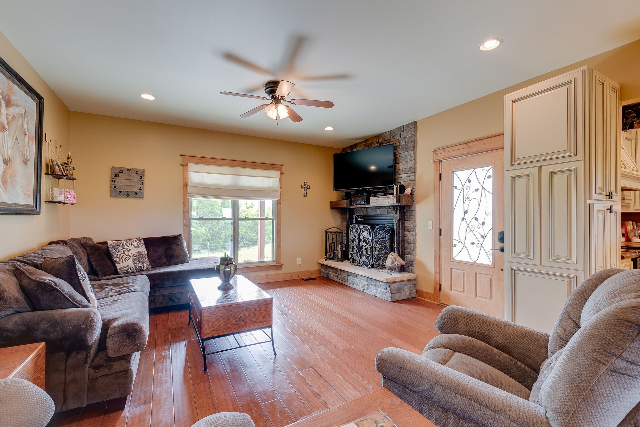 95 Switchboard Road Brush Creek, TN 38547 - Photo 9 of 35 a living room with furniture fireplace and a window