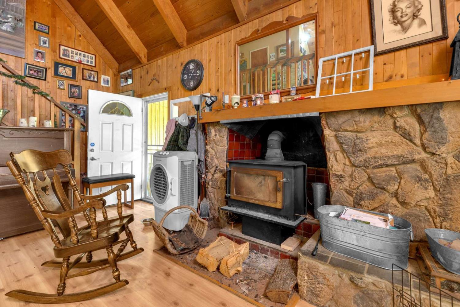13489 Yorkshire Road Groveland, CA 95321 - Photo 13 of 35 a living room with fireplace furniture and a fireplace
