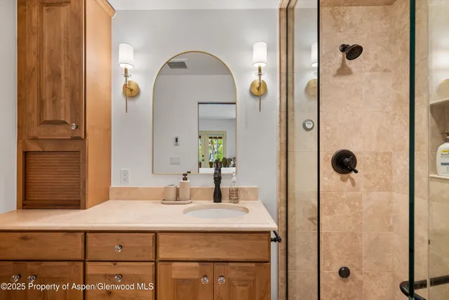 a bathroom with a sink and mirror