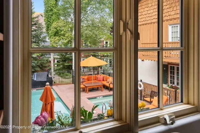 a view of swimming pool from a window