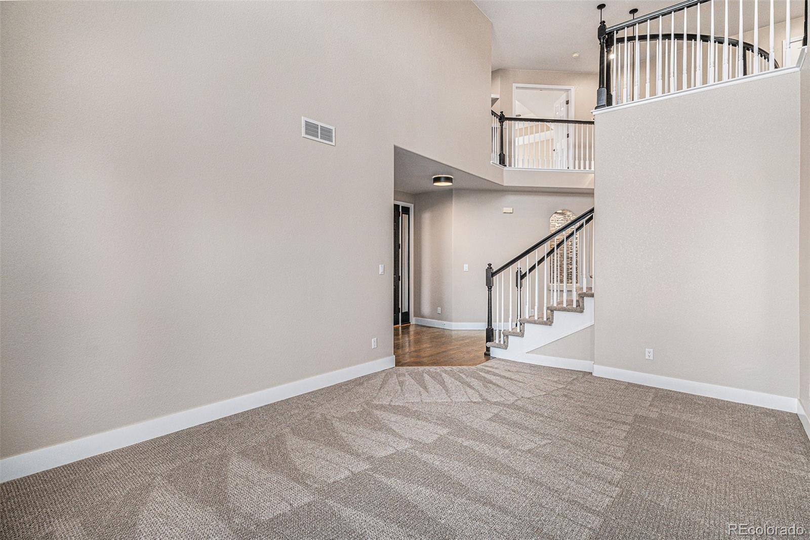 12665 South Robinson Ranch Boulevard Parker, CO 80134 - Photo 14 of 38 a view of entryway with stairs
