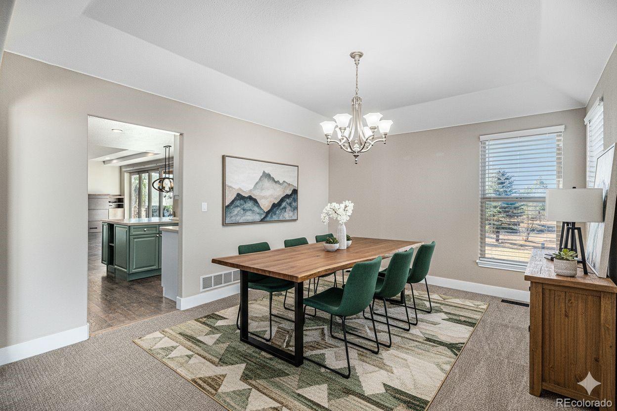 12665 South Robinson Ranch Boulevard Parker, CO 80134 - Photo 15 of 38 a view of a dining room with furniture window and wooden floor