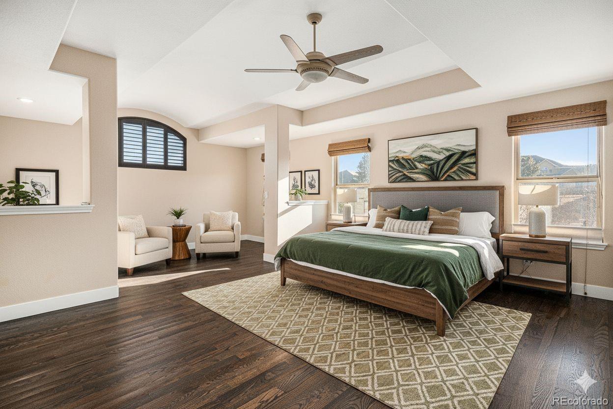 12665 South Robinson Ranch Boulevard Parker, CO 80134 - Photo 19 of 38 a bedroom with a bed and wooden floor