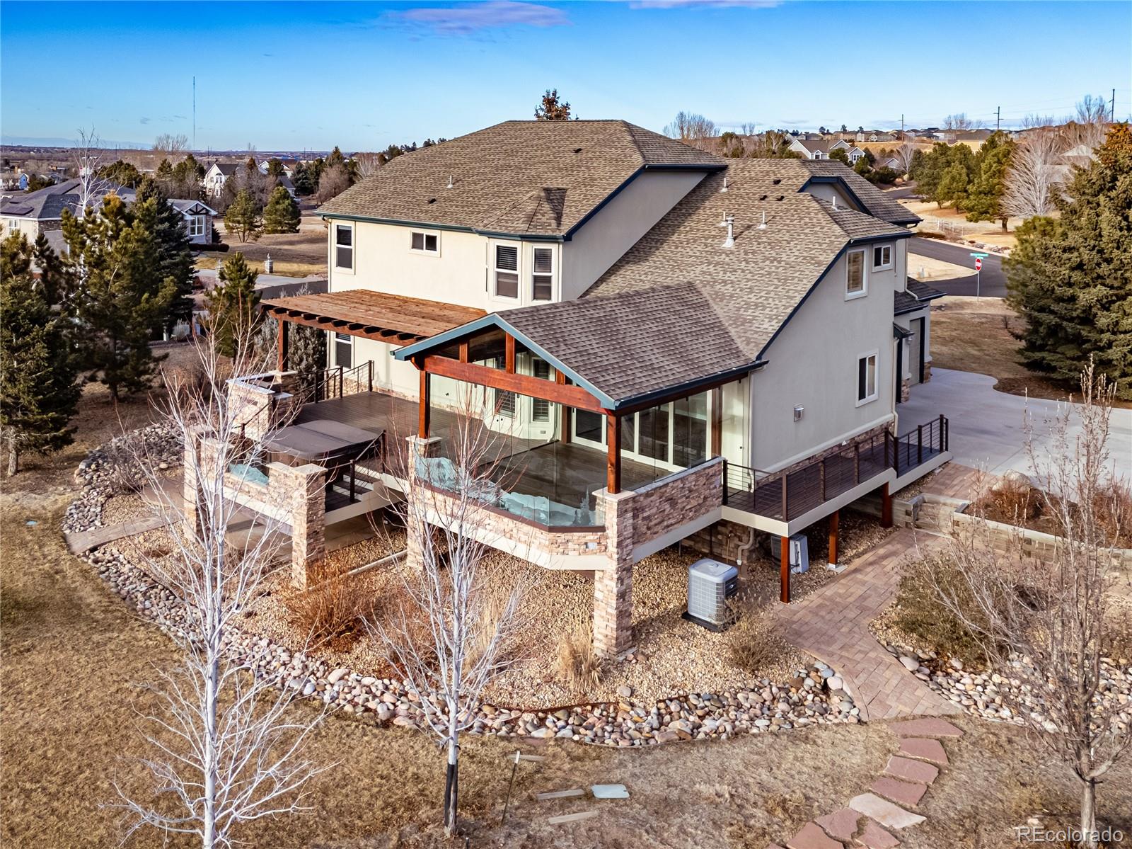 12665 South Robinson Ranch Boulevard Parker, CO 80134 - Photo 2 of 38 an aerial view of a house with a yard