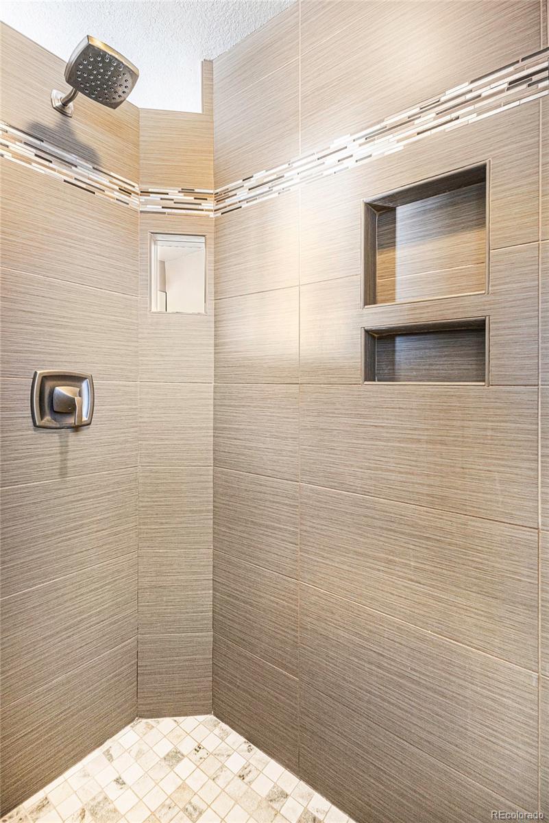 12665 South Robinson Ranch Boulevard Parker, CO 80134 - Photo 21 of 38 a bathroom with a shower