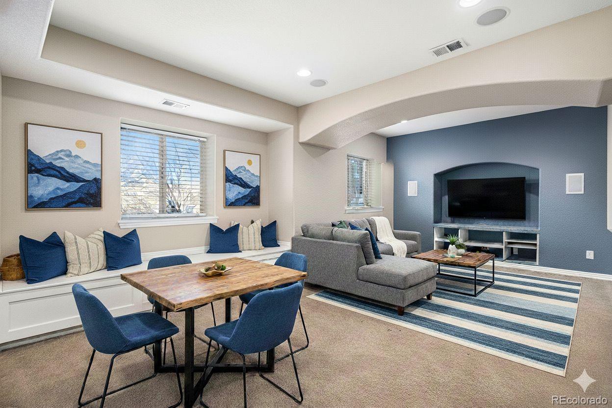 12665 South Robinson Ranch Boulevard Parker, CO 80134 - Photo 28 of 38 a living room with furniture and a flat screen tv