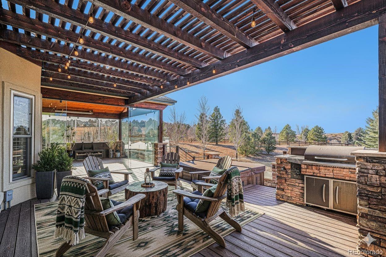12665 South Robinson Ranch Boulevard Parker, CO 80134 - Photo 6 of 38 a view of a patio with table and chairs
