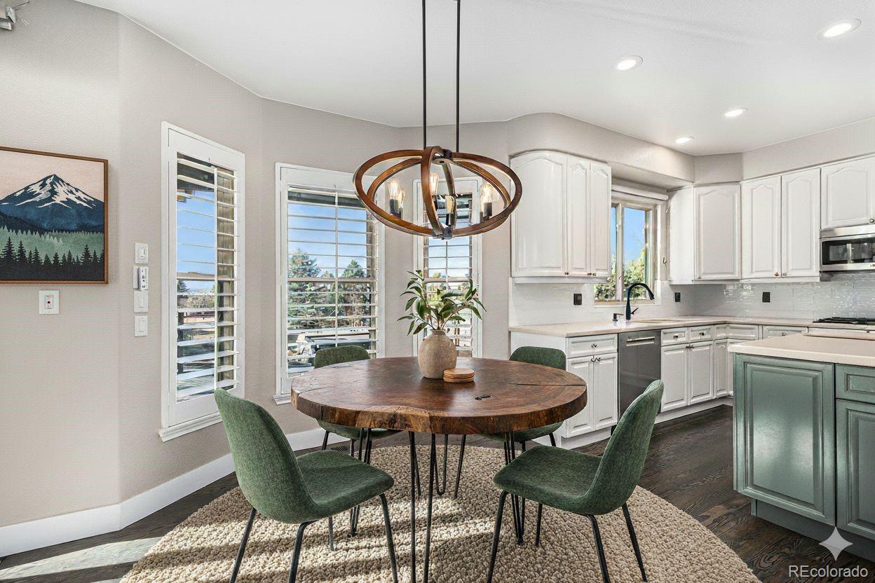 12665 South Robinson Ranch Boulevard Parker, CO 80134 - Photo 10 of 38 a view of a dining room with furniture window and wooden floor