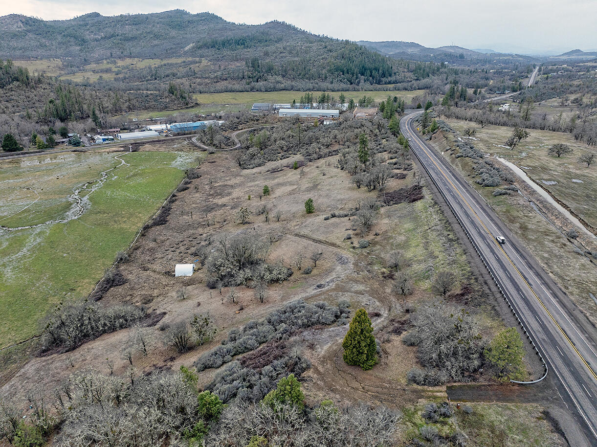 13546 Highway 140 Eagle Point, OR 97524 - Photo 7 of 24 a view of a lake with a mountain