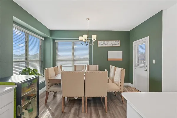 a view of a dining room with furniture window and outside view