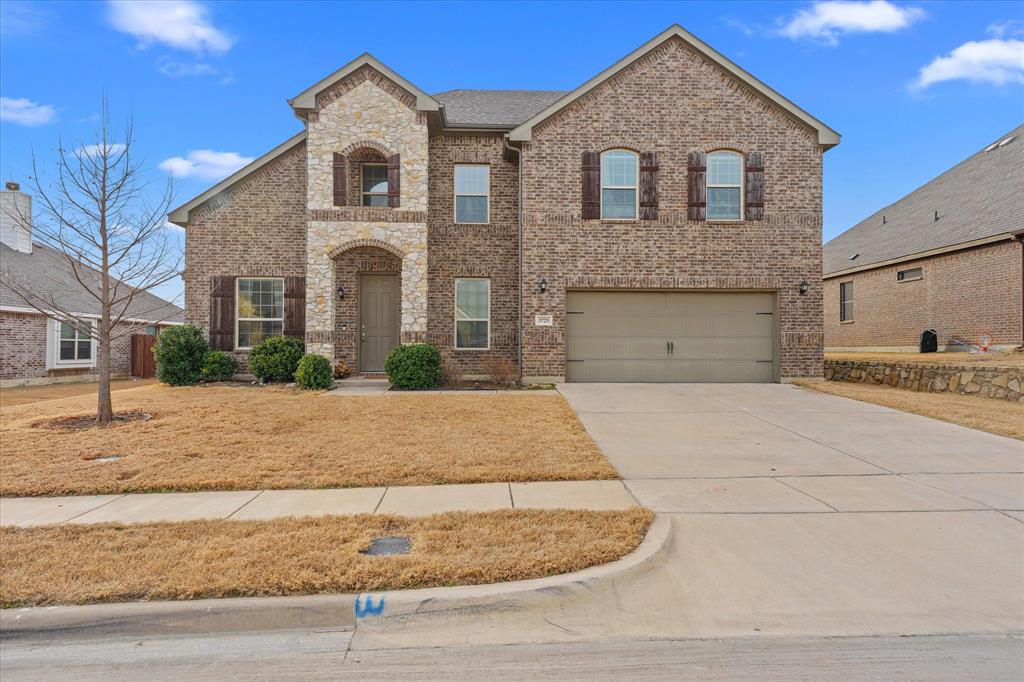 3725 Ranchers Ridge Krum, TX 76249 - Photo 2 of 38 a front view of a house with a yard