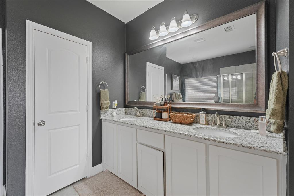 3725 Ranchers Ridge Krum, TX 76249 - Photo 24 of 38 a bathroom with double vanity and a mirror