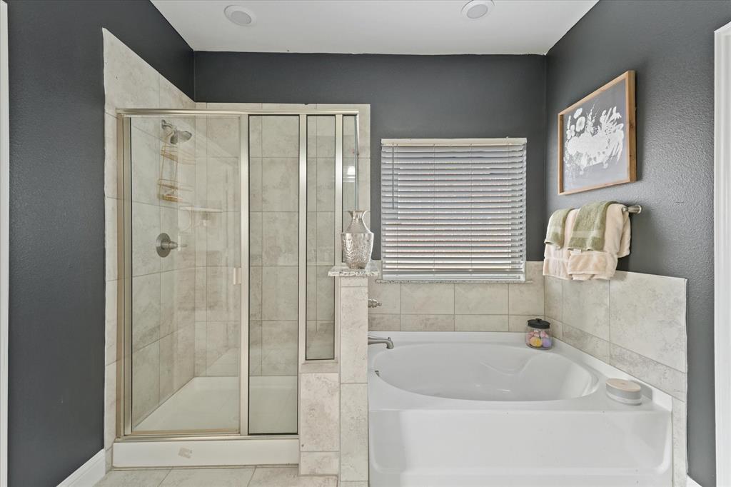 3725 Ranchers Ridge Krum, TX 76249 - Photo 25 of 38 a bathroom with a bathtub and a shower