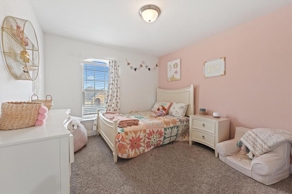 3725 Ranchers Ridge Krum, TX 76249 - Photo 29 of 38 a bedroom with bed and a couch