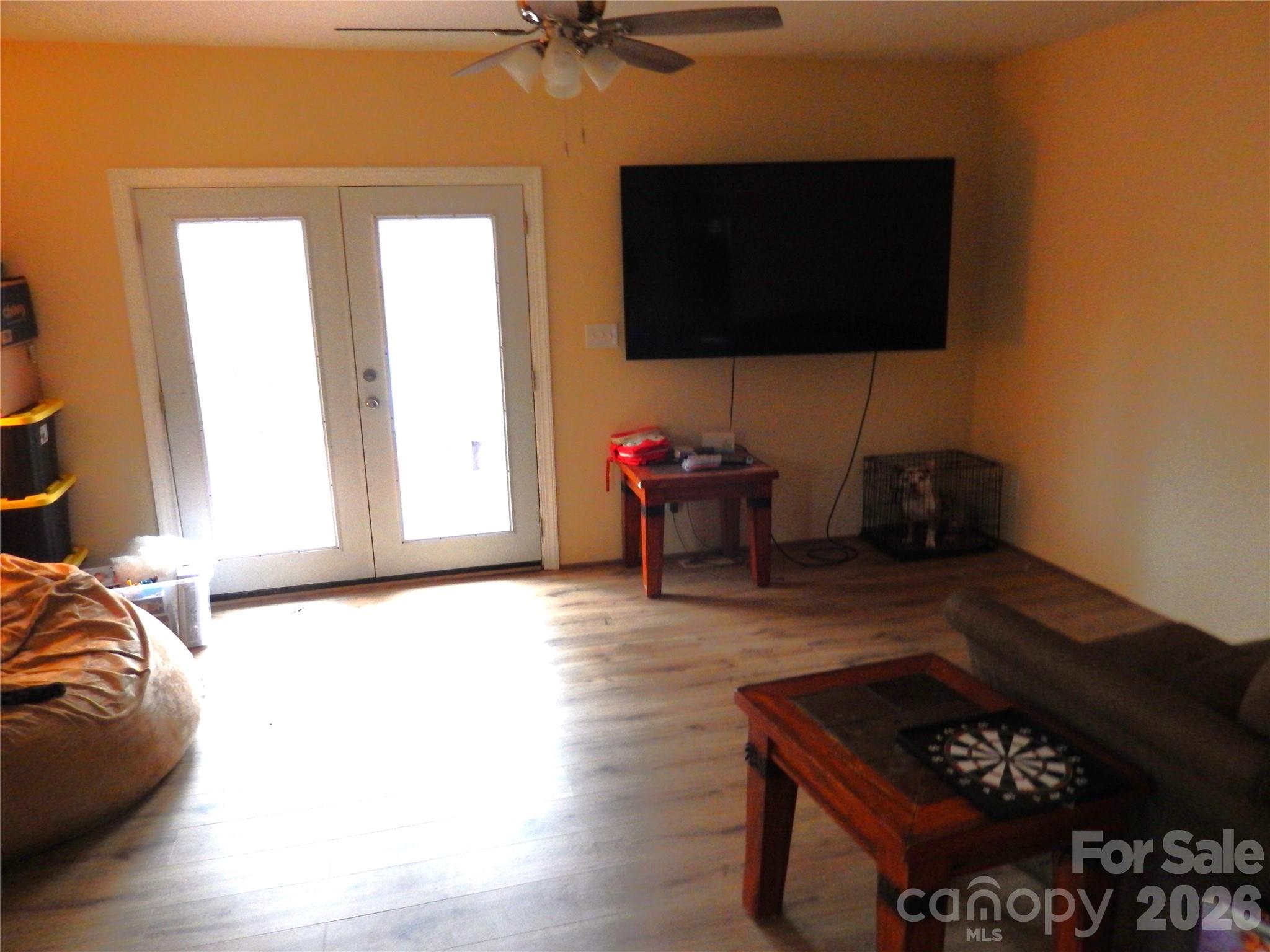 549 Brent Road Raleigh, NC 27606 - Photo 2 of 9 a living room with furniture and a flat screen tv