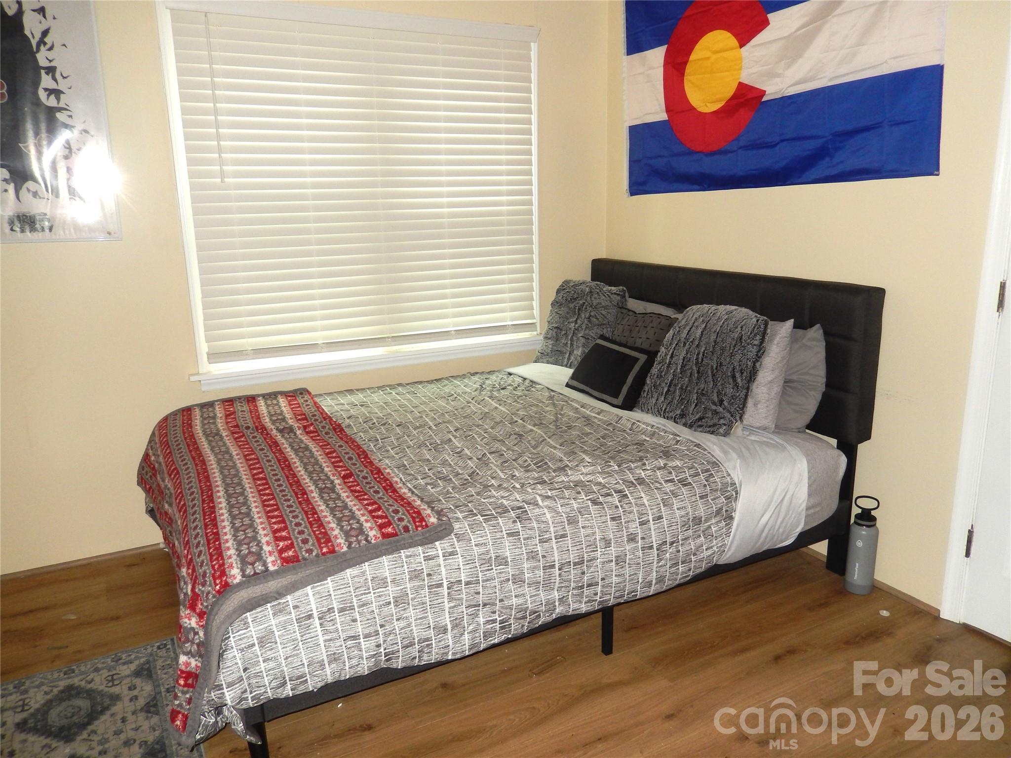 549 Brent Road Raleigh, NC 27606 - Photo 7 of 9 a bedroom with a bed and dresser