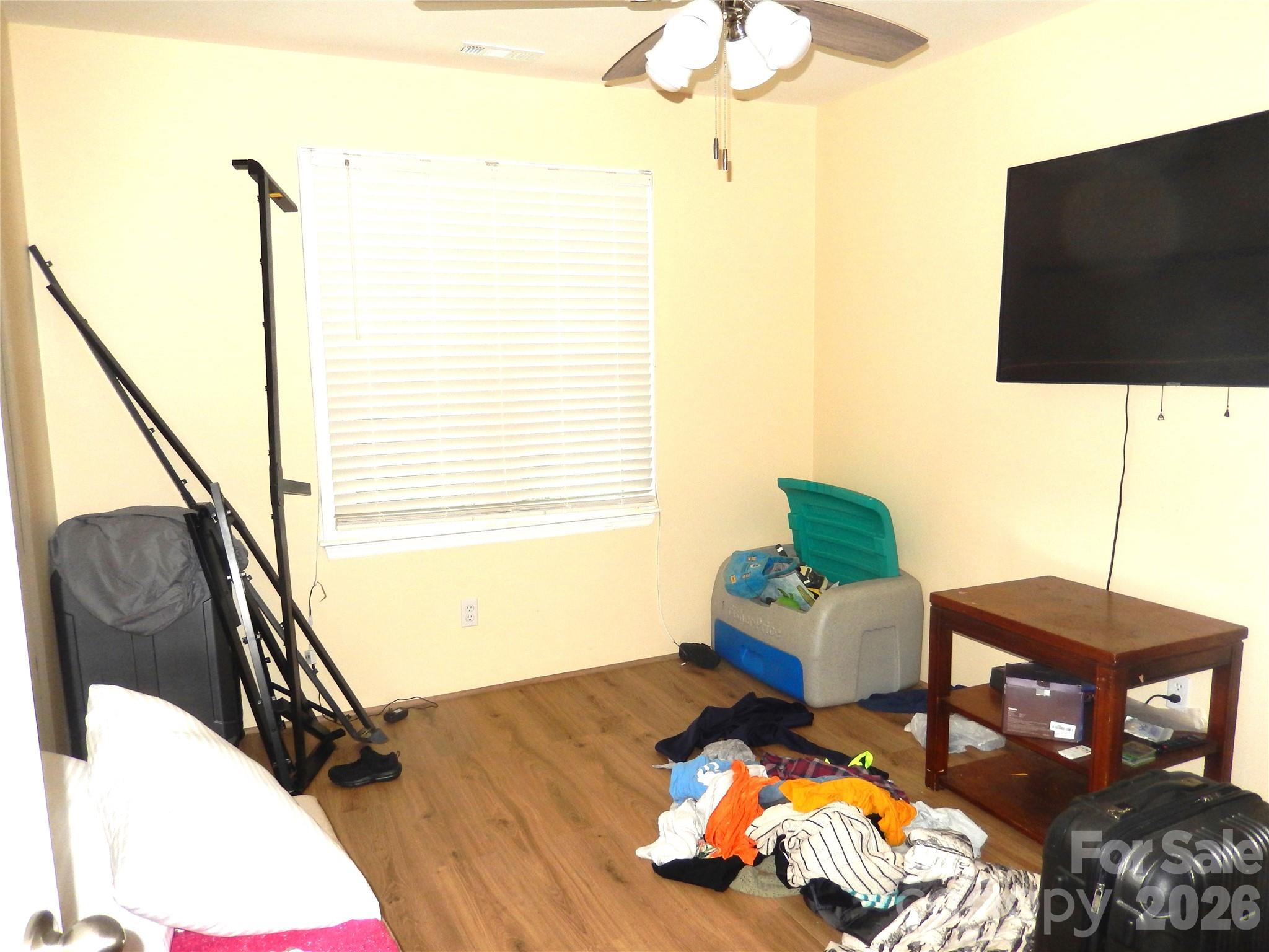 549 Brent Road Raleigh, NC 27606 - Photo 8 of 9 a living room with furniture and a flat screen tv