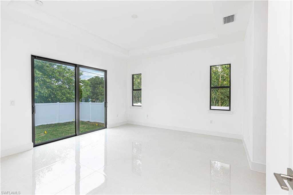 3074 Pine Tree Drive Naples, FL 34112 - Photo 15 of 18 a view of a room with a window