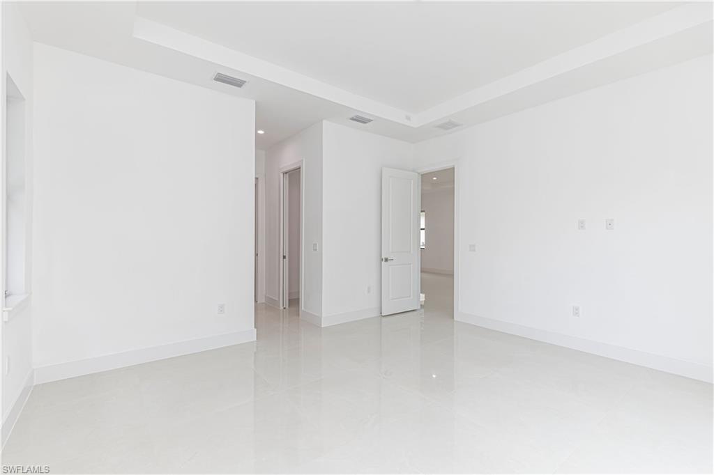 3074 Pine Tree Drive Naples, FL 34112 - Photo 16 of 18 a view of an empty room