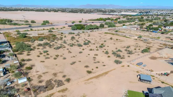 an aerial view of beach with residential house and outdoor space