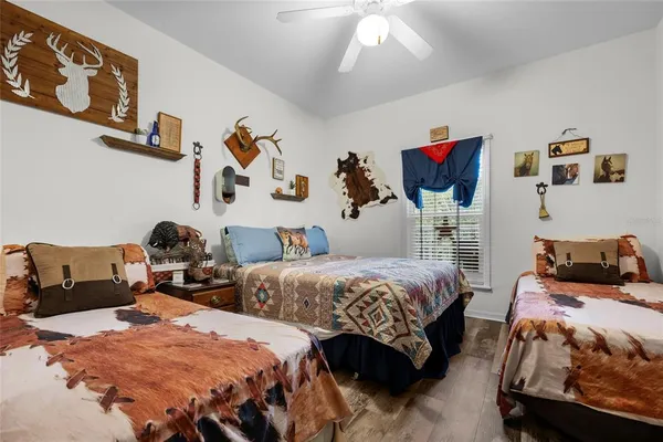 a bathroom with a sink toilet a mirror and shower