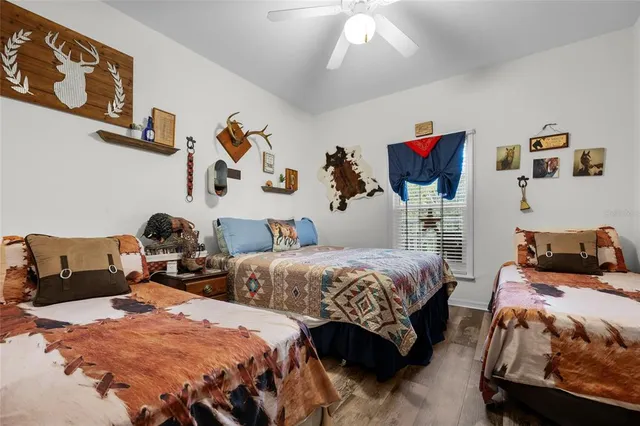 a bathroom with a sink toilet a mirror and shower